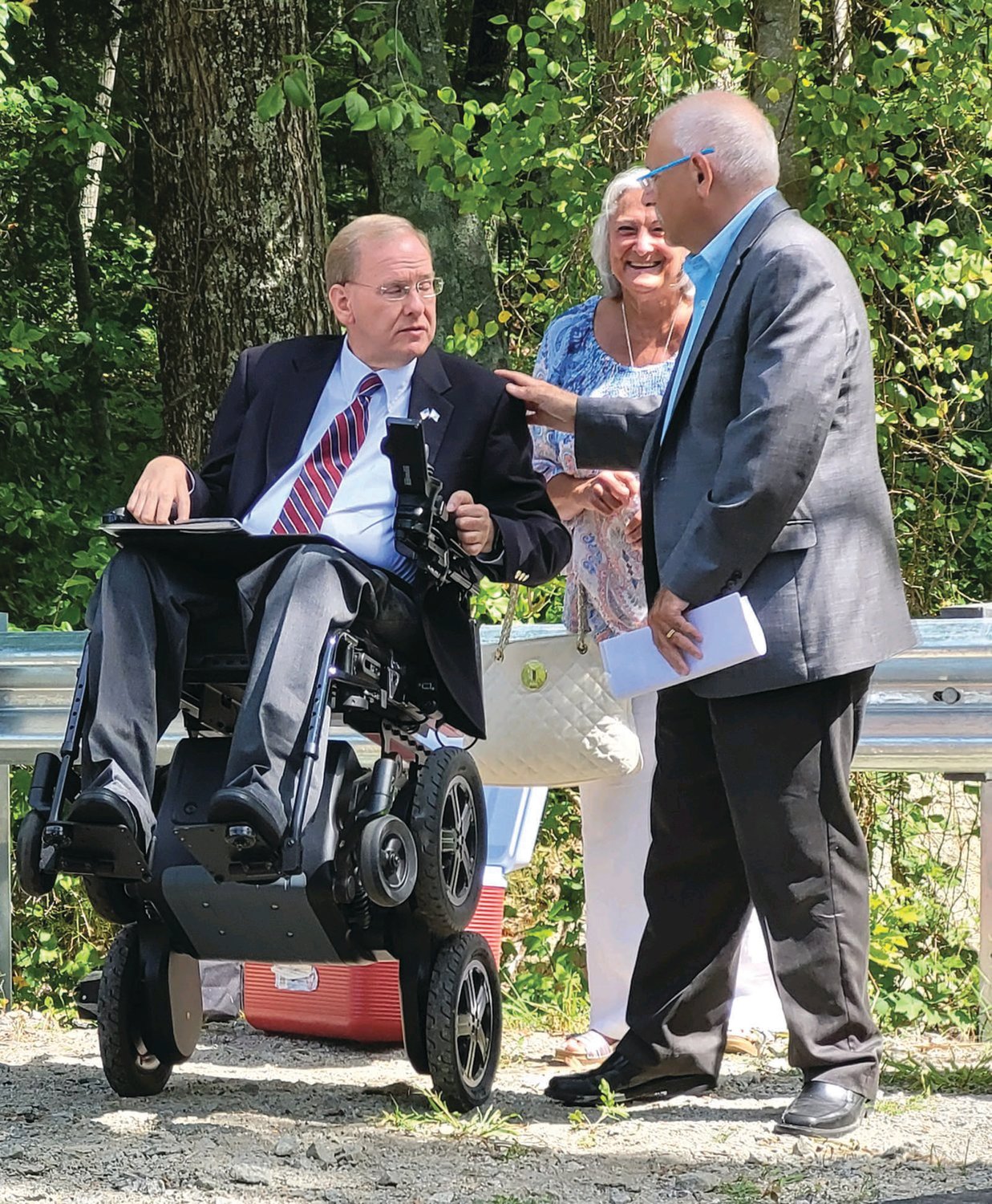 LOCAL & FEDERAL: In August, Johnston Mayor Joseph M. Polisena shakes hands with
U.S. Rep. James Langevin at an event on Belfield Drive touting floodplain improvements
in Johnston, aided by the USDA, in a cooperative effort with town and state officials.